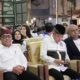Tiga tokoh duduk di barisan depan acara pengukuhan Askab PSSI Banyuwangi 2025–2029 di Aula AIL.