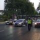 mobil patroli polisi nyaris tabrak rombongan PM Laos