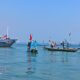 Pengibaran Bendera Merah Putih di Selat Madura oleh Ditpolairud Polda Jatim untuk Peringati HUT RI ke-79
