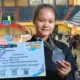 Adelia Dwi Cahya Anggraini dari SMPN 1 Glagah menerima piagam Juara II tanding Kelas G Putri Pra Remaja pada The Sunrise of Java Silat Championship 1 di GOR Tawangalun Banyuwangi.