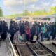 Penumpang turun dari KA Sangkuriang di Stasiun Banyuwangi Kota saat kedatangan kereta api.